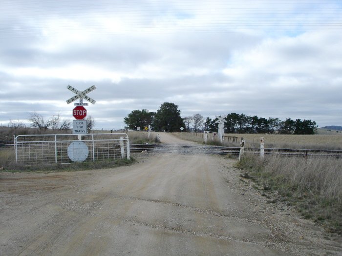 The Oolong Road level crossing, at the down end of the location.