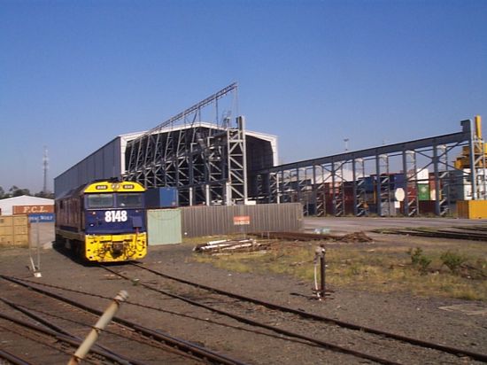 Part of Pacific National's container terminal at Chullora. 8148 is one of the resident shunters.