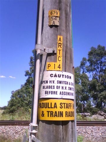 Signs on the pole noting that this is the former Padulla Staff Hut.