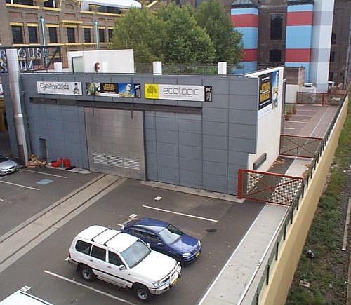 
The two lines which make up the Powerhouse Sidings.  The original siding
(on the left) passes through the cafeteria, and is used for static
display purposes.  The new sidings (adjacent to the cars) is intended
for loading passengers on tour trains.  The flange gaps are covered
by removable metal plates.
