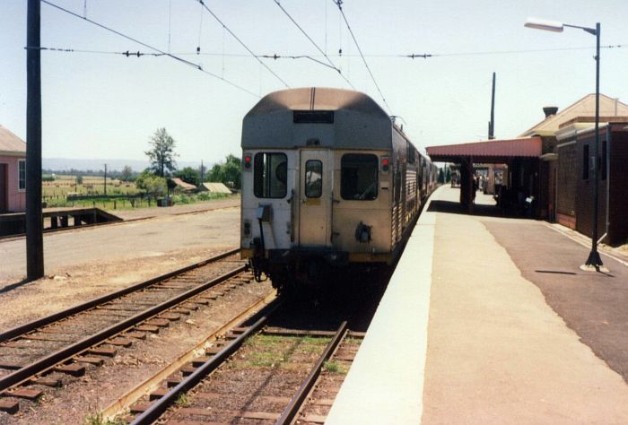 
An electric train has stopped at Riverstone, at the time the limit
for electrification of the line.
