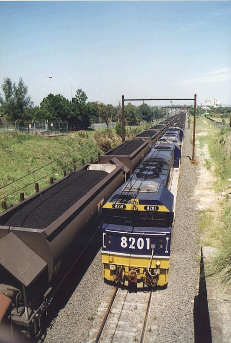 
The unusual site of load coal trains passing in opposite directions along
the goods line adjacent to Rookwood Cemetery.
