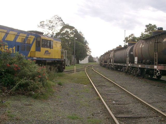 
The view looking up the line towards Camellia, with Silverton 45s1 shut
down in a siding.  The photo is taken from the location of the Sandown
platform.
