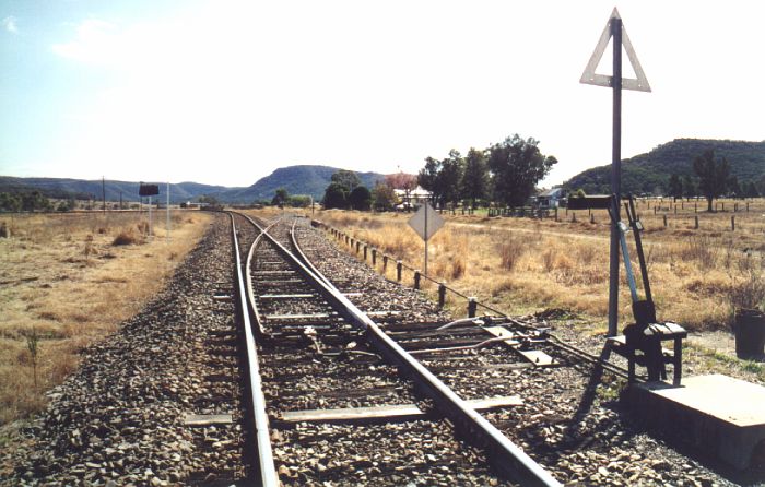 
The junction of the one-time main line to Sandy Hollow.  The line to
Ulan and Gulgong curves away on the left, with the first 100m of the
branch line available as a perway siding.
