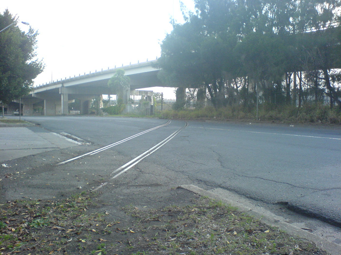 The view looking towards the junction where the siding comes off the main line, under the freeway.