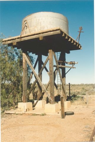 A closer view of the small elevated water tank.