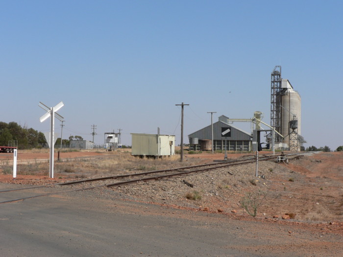 The view looking north-west towards the silos. The station was located on the right hand side of the line.