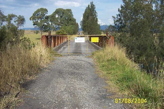 
The line then crossed a small creek via this steel bridge, The bridge has
had concrete poured over it for road usage.
