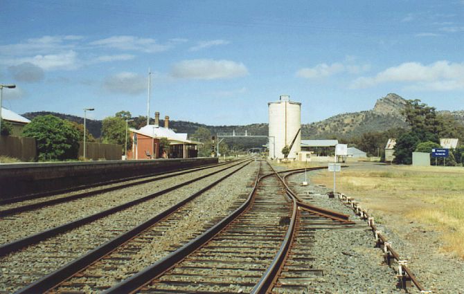 
The Rock Station, with the adjacent silos and the landmark peak in the
background.  The line in the centre is the beginning of the branch to
Oaklands.
