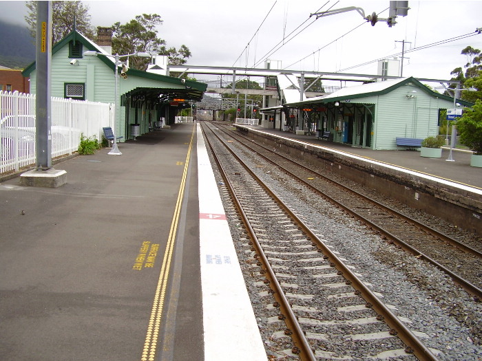 View from the up platform at Thirroul looking towards Sydney with the island platform for down trains and local services on the right.