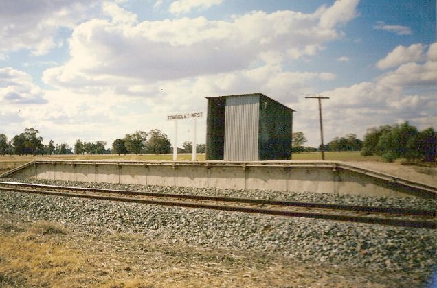 The truncated platform still has a primitive shelter and signpost.