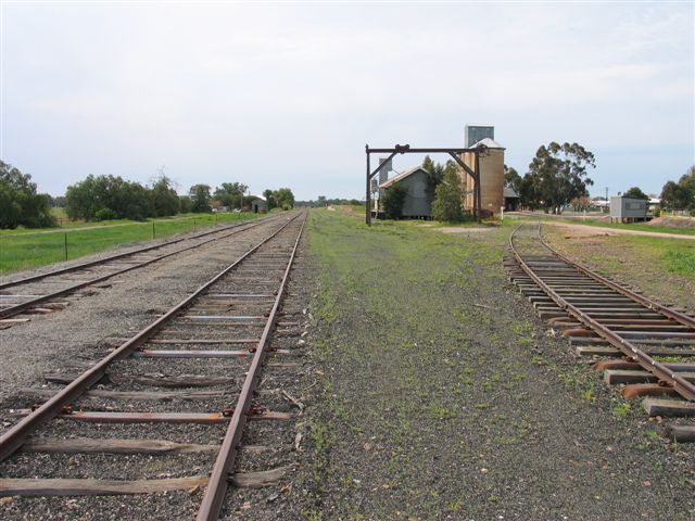 The view looking north showing (from left to right) the main line, loop line and goods siding.  The gantry crane and goods siding were associated with a partly-lifted goods siding.