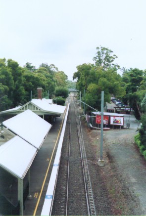 The view looking north towards Warrawee from the footbridge. The former goods siding was located on right of the up main.
