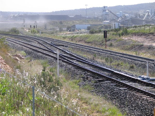 
The view looking towards the coal loader.  The line in the foreground is
the main line between Sandy Hollow and Gulgong, with the other tracks
forming the balloon loop.
