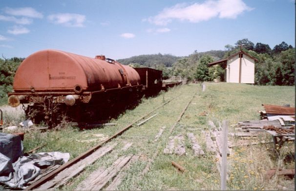 
The yard contains a number of wagon, including a water gin.
