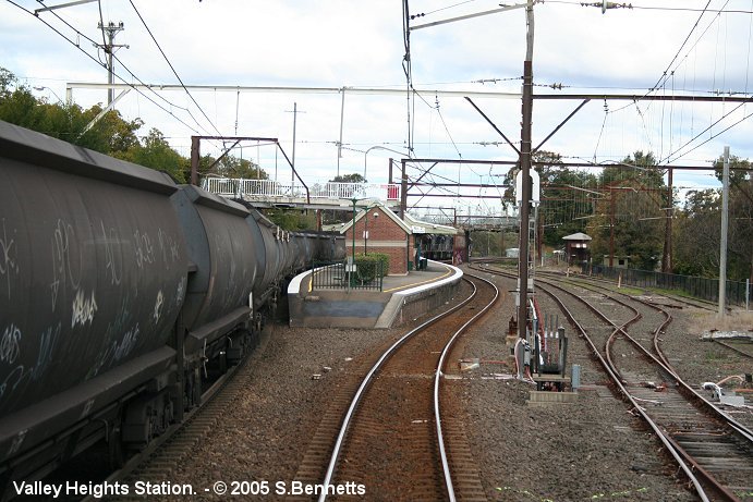 Approaching western end of Valley Heights station, taken from front of Up service travelling on the Down Main.  Due to the overhead wiring being brought down between Doonside and Blacktown in the morning, 2 coal trains were held between Valley Heights and Springwood nose to tail. (a Lidsdale coal and a Charbon coal about 200 metres apart). As a result, all Up services had to travel via the Down line to eastern end of Valley Heights then cross back to the Up.