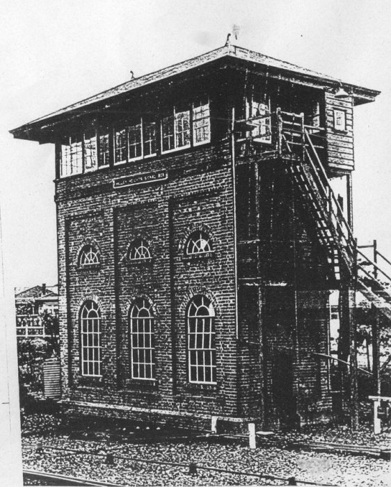 A photo of a photocopied photo which shows the old Valley Heights Signal Box. The writing and call numbers and description on side of photocopy are unreadable but it appears to have come from either State Records or ARHS. Handwriting below photocopy reads, "Before it burnt down".  This photocopy was until recently on the wall of the waiting room at Valley Heights station. Along with another shot of the box there are 2 others which are very bad photocopies showing the elevated coal road and Valley Heights depot dated in handwriting 1959. These were taken down when the station waiting room was painted.