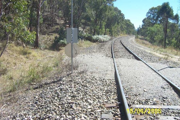 A vire of the track on the vicinity of the one-time station location. There is also an old track behind the sign that leads up the mountain side.