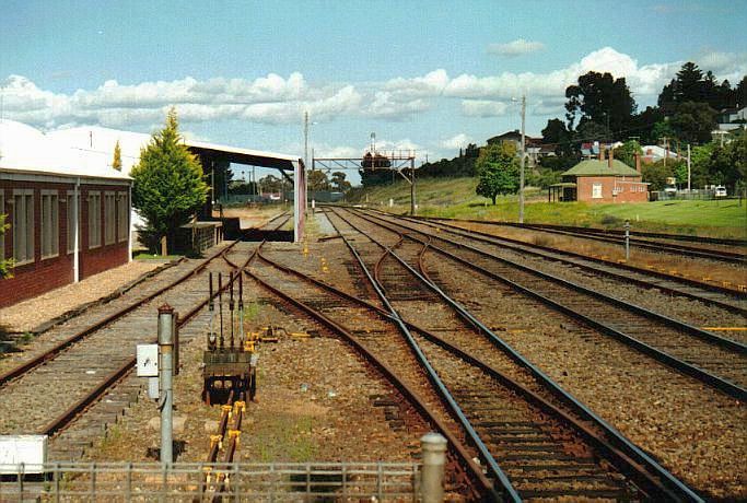 
The view of the yard, from the platform looking in the direction of Sydney.
The three lines extending under the gantry into the distance are the 
Platform Loop, Main Line and former branch line to Tumbarumba.
