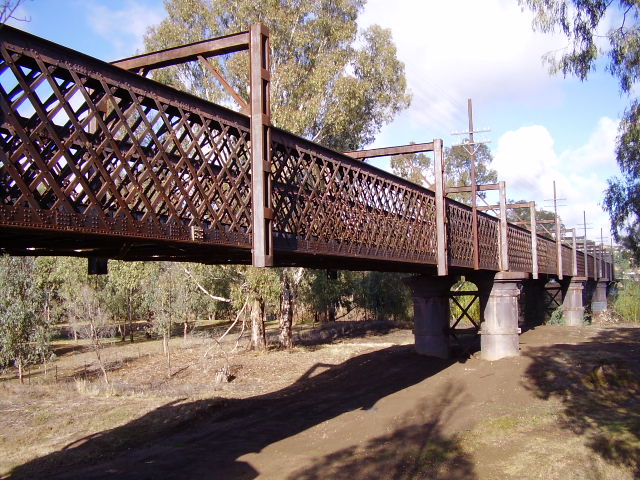 The view from the northern bank of the Murrumbidgee River of the western side of the rail bridge.