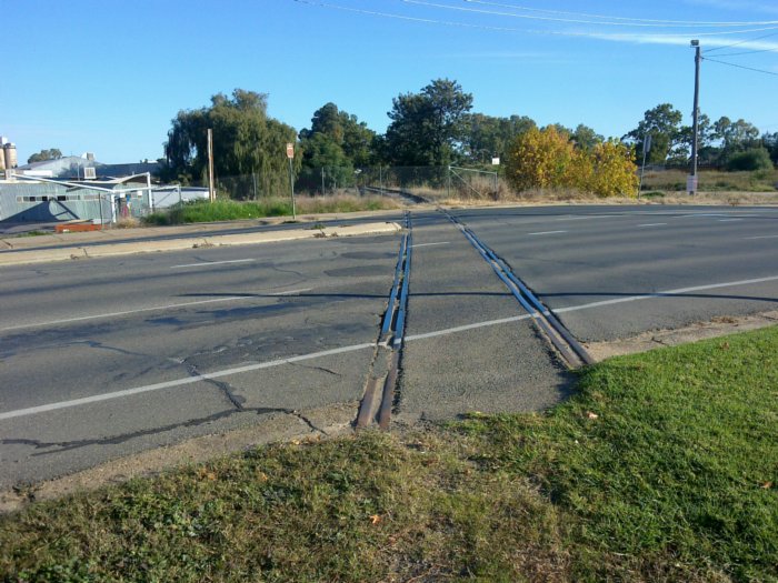 The view looking down the former branch to Tumbarumba as it crosses Lake Albert road.