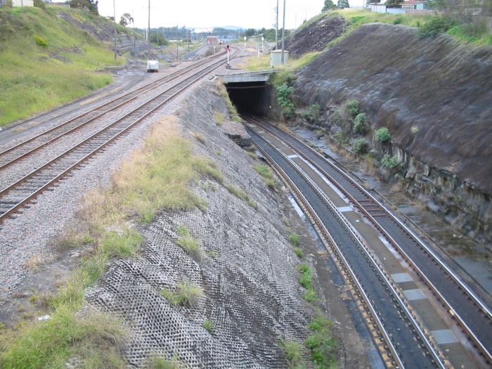 
The view looking west towards Warabrook, where the coal roads dive under the
main lines.  Hanbury Junction signal box is visible in the middle distance.
