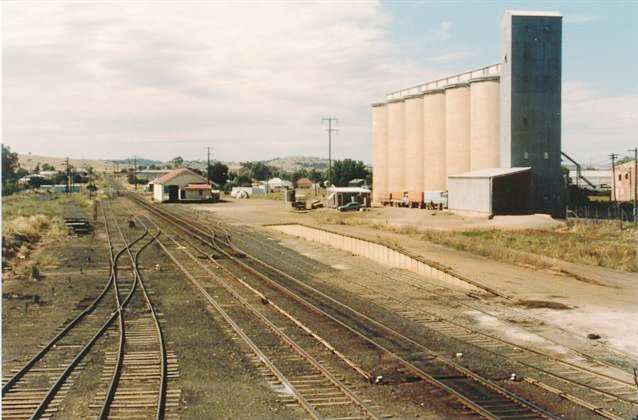 A view looking up the line towards the goods shed, loading bank and silos.