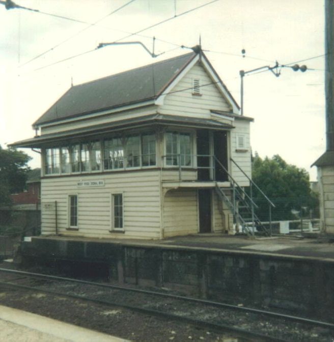 
West Ryde Signal box on the south end of the down platform.  Behind and
below the box is the Victoria Road underbridge.
