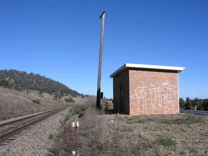 
A modern brick signalling hut stands on the location of the one-time station,
in this view looking south.
