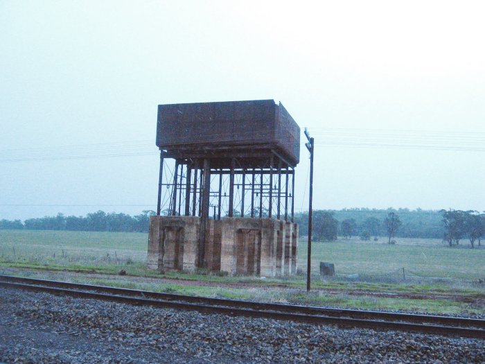 The elevated water tank, with a piece of the corner missing, presumably due to a lightning strike.