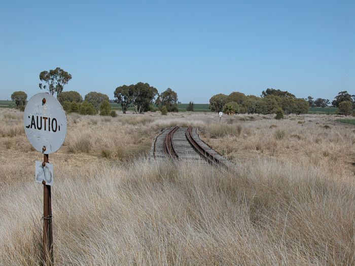 
Just before the station the line crosses a small bridge.  The tightness of the
curve has necessitated the use of check rails to prevent derailments.
