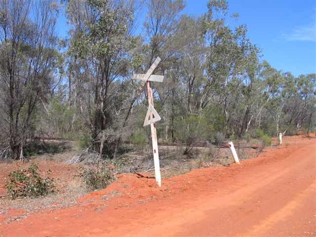 
The level-crossing sign, warning of trains long after the last one went by.
