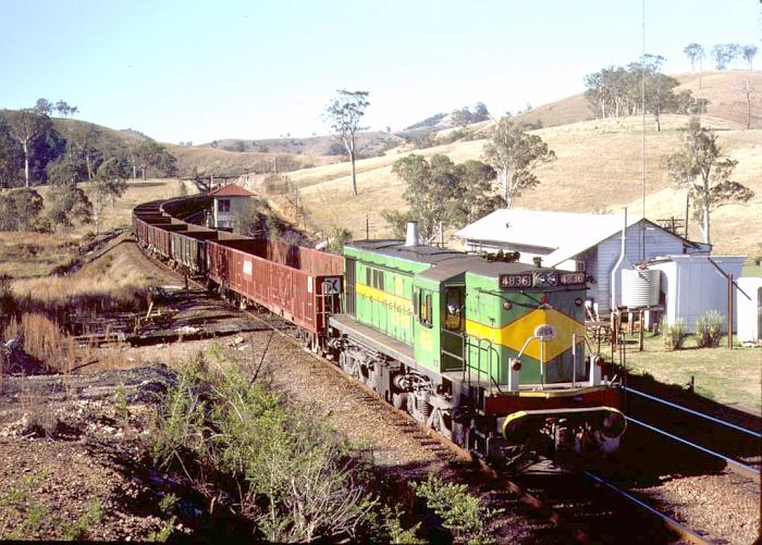 
4836 heads south with a load of empty open wagons through the one-time
crossing loop at Yumbunga.
